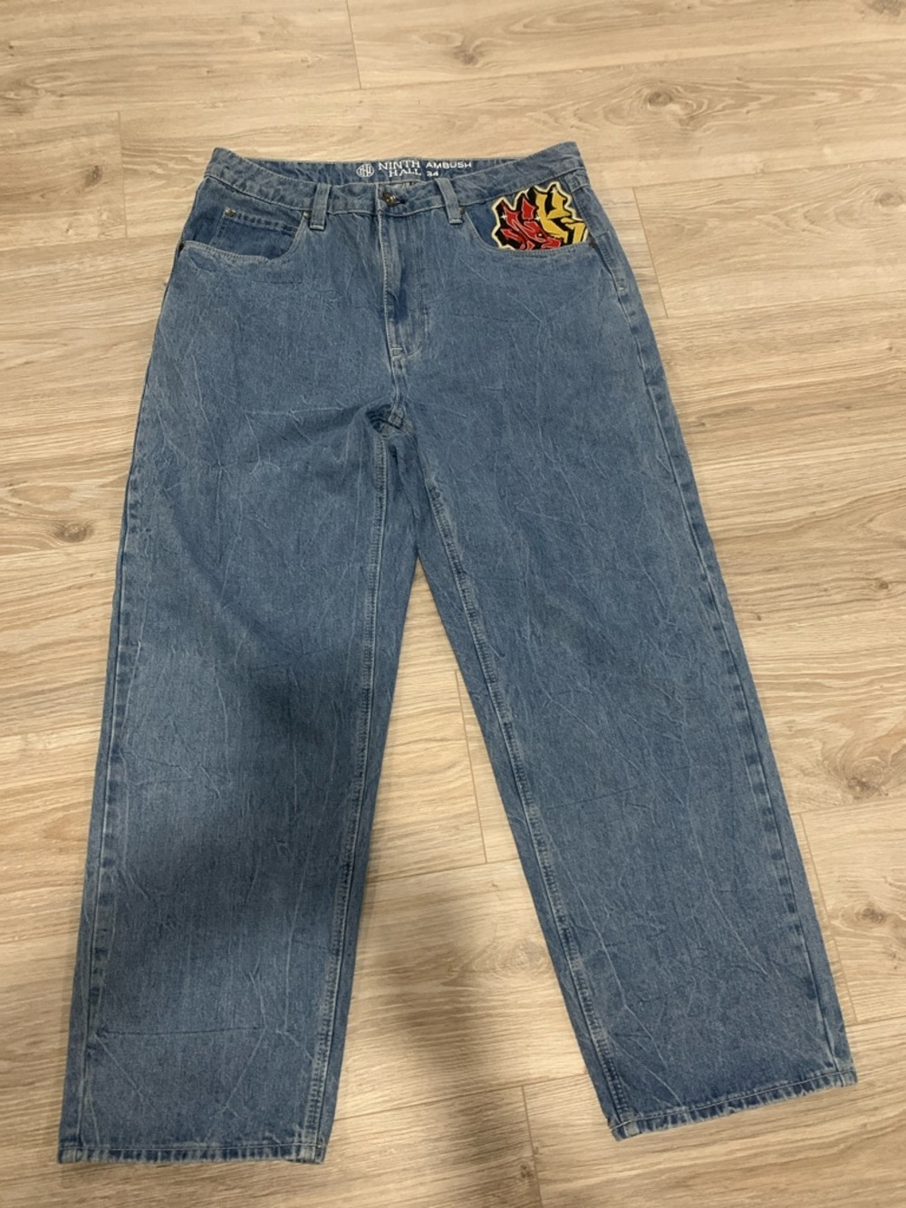 Relaxed Blue Men’s Jeans with Flame Patch by NINETY AMBUSH